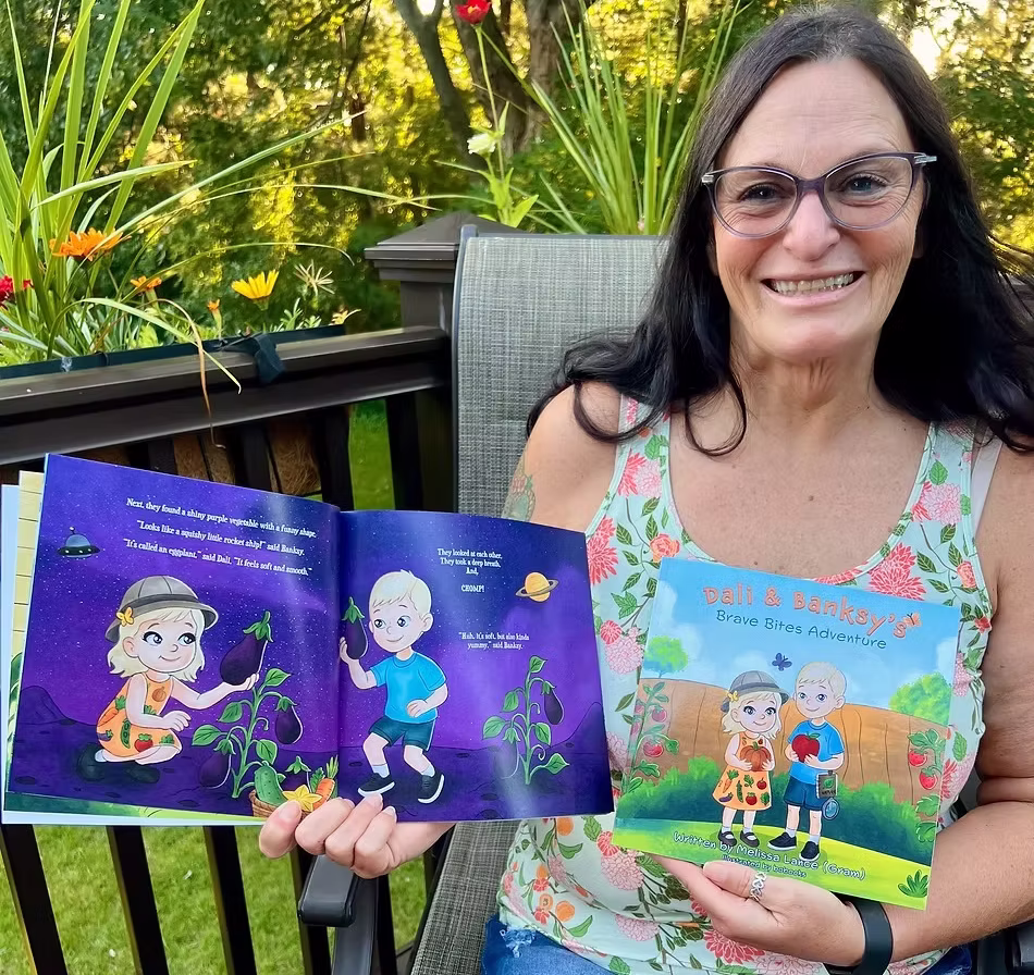 Melissa holding her children's books